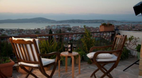 Гостиница Gunebakan Taliani Hotel  Айвалык